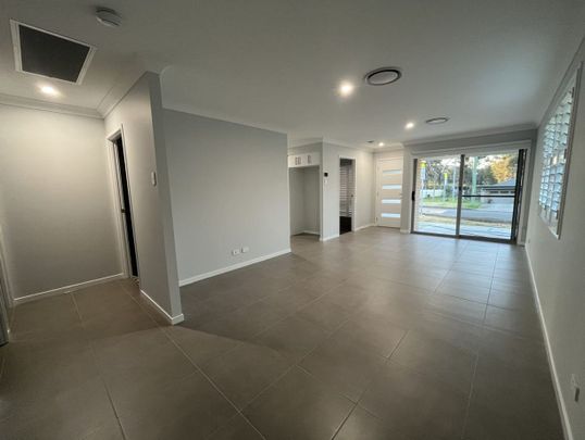 Stylish Modern Home with Ducted A/C & Water Included - Photo 1