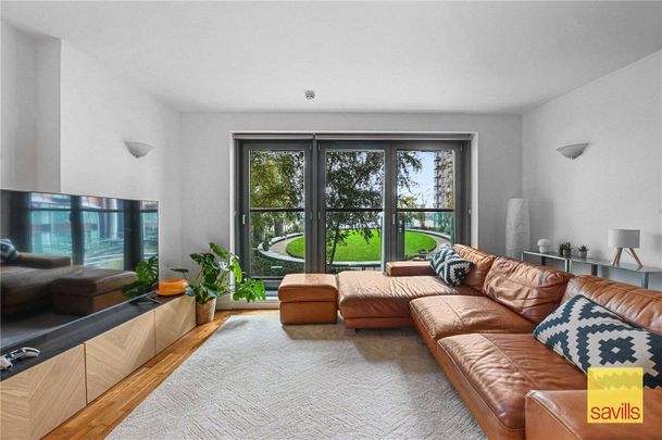 Available Now & Part Furnished, A beautifully presented two-bedroom apartment located on the first floor of the prestigious riverside development, New Providence Wharf. - Photo 1