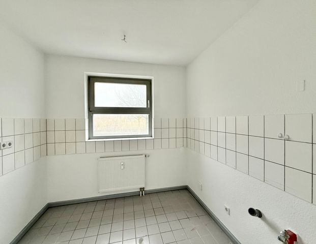 Schöne 3-Zimmer-Erdgeschosswohnung mit Balkon in zentrumsnaher Lage - Photo 1