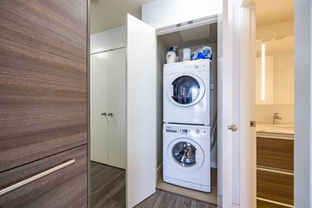 2 Bed Condo | Surrey University District | Parking • Den - Photo 3