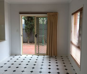 Neat Three Bedroom Courtyard - Photo 1