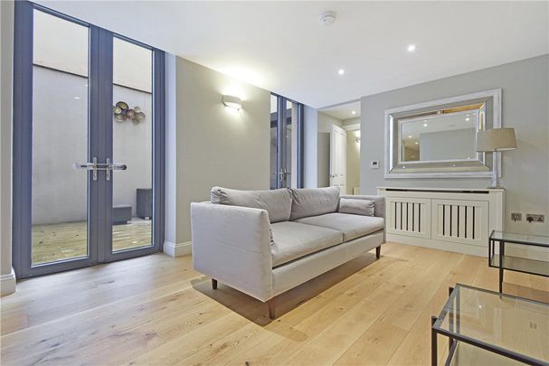 This is a recently renovated and beautifully designed apartment, which spans about 2,741 sq. ft. and is located in an impressive Grade II listed Robert Adam building on Portland Place. - Photo 1