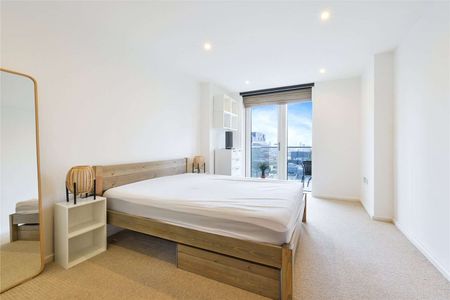 This luxurious 2-bedroom, 2-bathroom 1046sqft apartment on the higher floors of Ability Place, E14, offers contemporary living in one of London's most desirable locations. - Photo 5