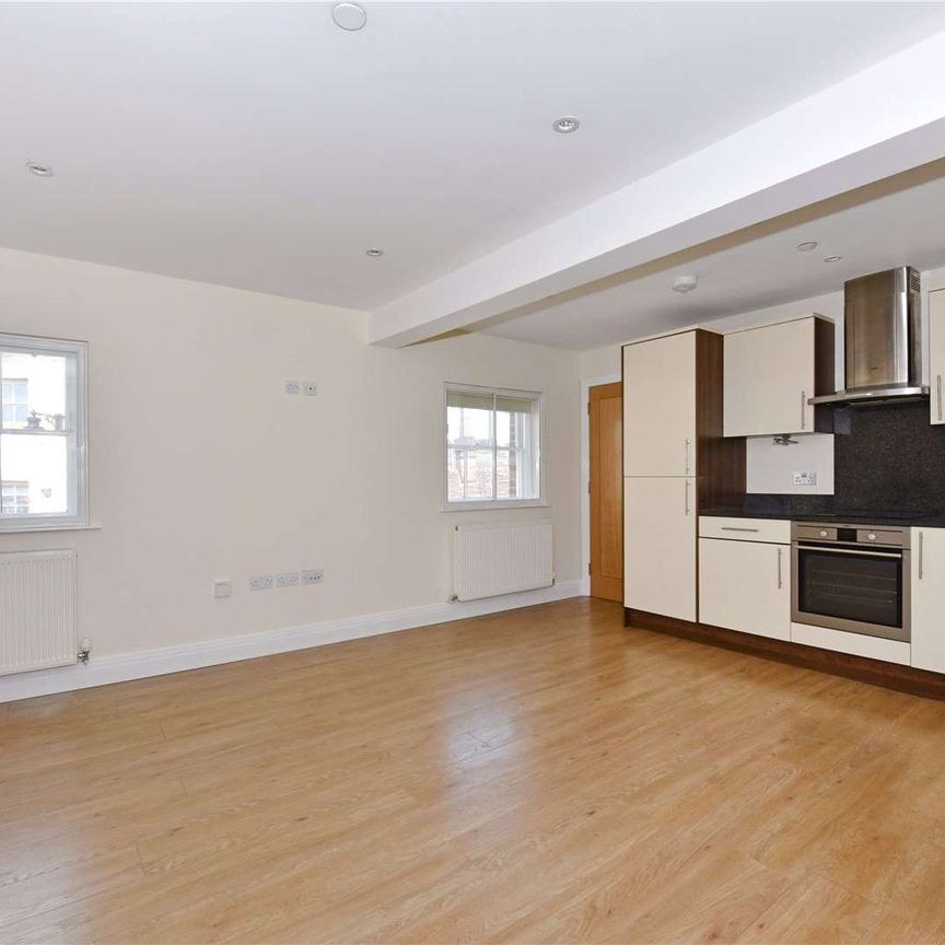 Centrally located one bedroom top floor apartment. One allocated parking space included. - Photo 1