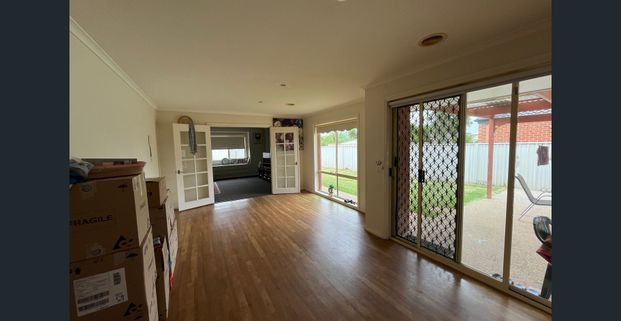 Modern 4-Bedroom Home with Multiple Living Areas - Photo 1