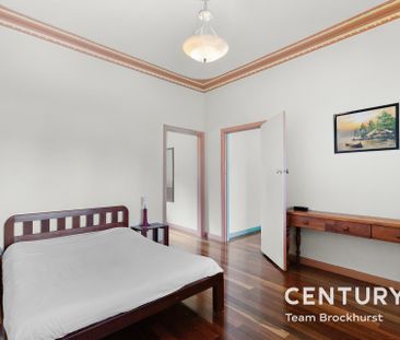 Charming 1950s Home with Modern Flexibility & Pristine Gardens! - Photo 6