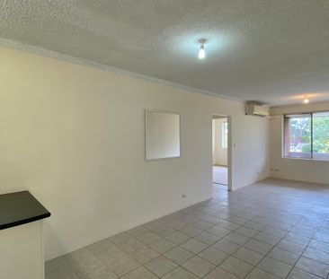 Top-Floor 2-Bedroom Unit with Privacy, Tree Views & Convenient Cent... - Photo 1