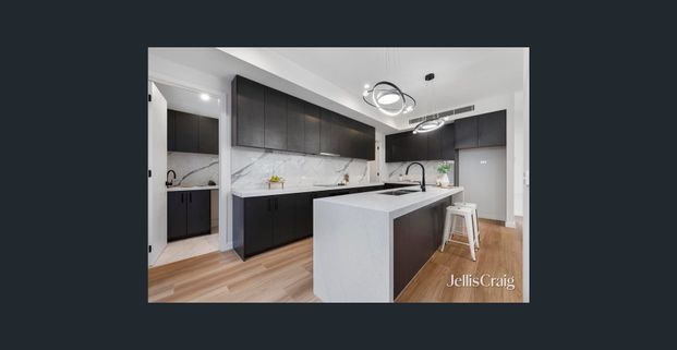 Big, bright and designed for easy family living with access from Schulz Street. - Photo 1