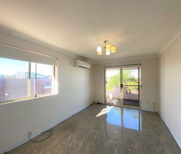 Bright and Sunny, Tiled Unit with Split System AC! - Photo 1