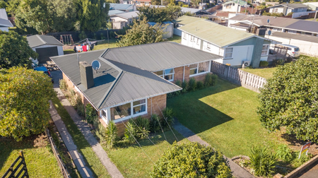 Roomy three bedroom family home, open plan living area, modern kitchen with a dishwasher, single garage. - Photo 2