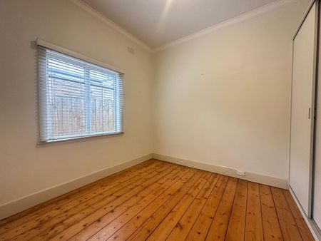 Spacious 3-Bedroom Home with Sunroom & Great Backyard - Photo 5