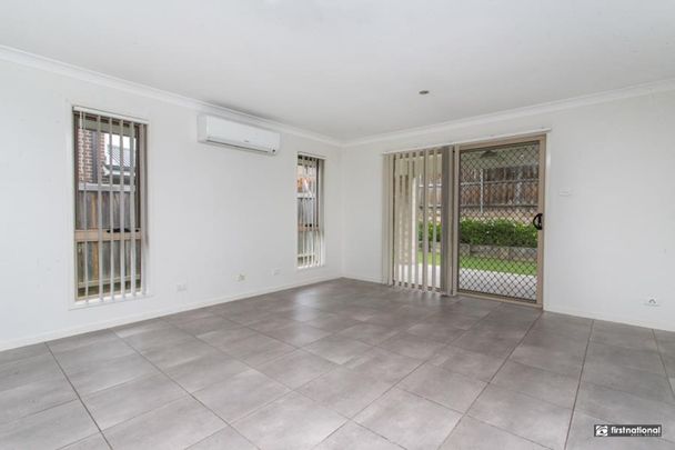 Spacious 4-Bedroom Home with Low-Maintenance Yard - Photo 1