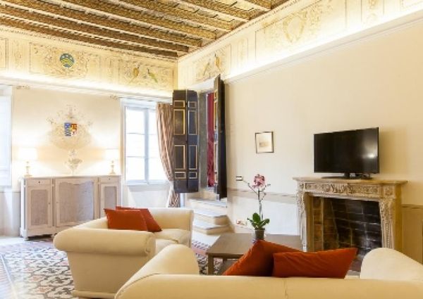 Center-Historic Jewish Quarter: Elegant apartment situated in beautiful Palazzo Nobiliare. Entrance, spacious living with original wood frescoed ceilings, large modern dining and kitchen, 4 bedrooms, 4 Baths, small terrace. #1527