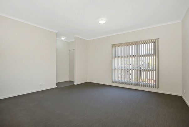 Spacious Three-Bedroom Townhouse - Photo 1