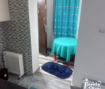 Garsonieră spațioasă cu facilități și grădină - Fotografie 1