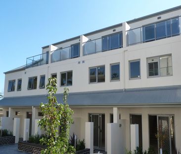 Spacious Two Bedroom Townhouse with Three Car Garage - Photo 1