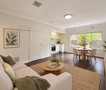 Unfurnished Downstairs One-Bedroom Apartment in Ultra-Convenient Lo... - Photo 1