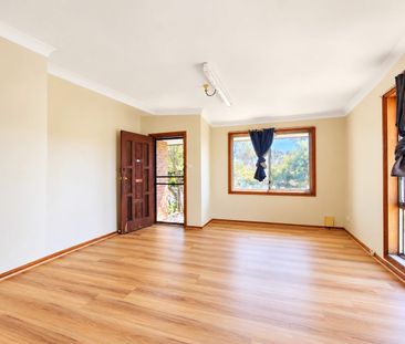 Unique Four-Bedroom Home with Flexible Dual-Living Layout - Photo 1