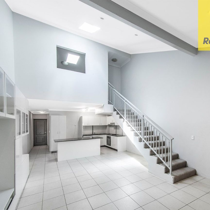 UNIQUE TWO-STOREY LIVING AT ITS BEST - Photo 1