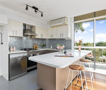Light Filled Apartment with Oversized Lockup Garage - Photo 4