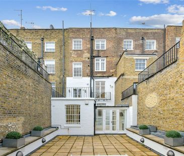 An expertly refurbished six bedroom house situated on this prestigious Knightsbridge garden square. - Photo 1