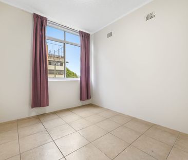 FRESHLY PAINTED- Bright & Well-Maintained 2 Bedroom Unit in Prime A... - Photo 1