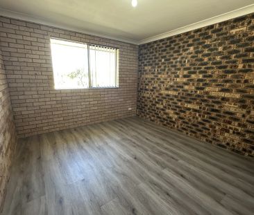 Solid Brick Family Home with Fenced Yard - Photo 4