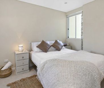 Sun-Drenched Dual-Level Living with Resort-Style Facilities - Photo 3