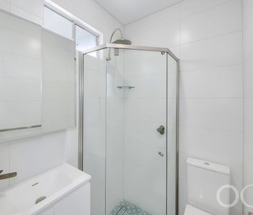 Open the Door to Coastal Charm with Modern Comfort - Photo 3