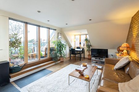 A beautifully presented two-bedroom top-floor apartment situated in the sought-after Denmark Lofts on Ridgway, at the heart of Wimbledon Village. - Photo 4