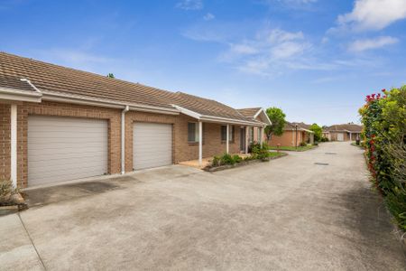 Nestled in a peaceful complex, this delightful two-bedroom unit offers comfort and convenience - Photo 2