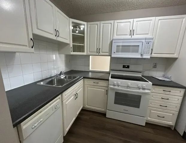 Upgraded 2 Bedroom 1 Bathroom Condo with Balcony!! Private Laundry + Parking!! | 3843 76 Street Northwest, Edmonton - Photo 1