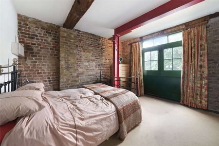 Set within a characterful period building, the property seamlessly blends industrial charm with contemporary living. - Photo 5