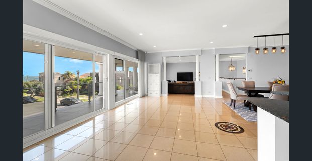 Elevated Coastal Luxury with Breathtaking Bay Views - Photo 1