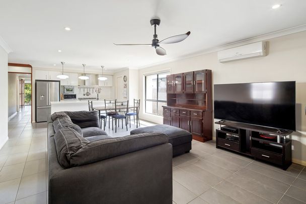 Stunning Family Home with Solar Power, 5 Air Conditioners & Premium Lifestyle Location - Photo 1