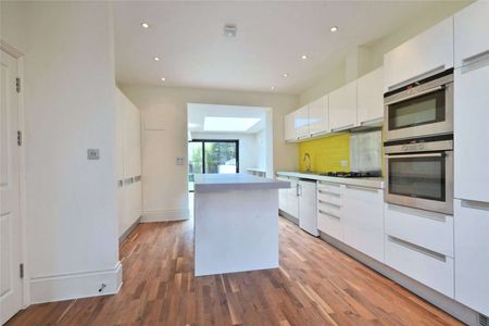 Located close to the amenities of Hampstead Heath is this five/six bedroom family home - Photo 2