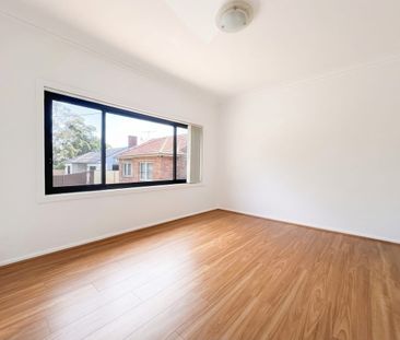 Charming Brick Home with Modern Renovations and Versatile Living Sp... - Photo 1