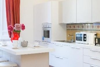 Center-Historic Jewish Quarter: Elegant apartment situated in beautiful Palazzo Nobiliare. Entrance, spacious living with original wood frescoed ceilings, large modern dining and kitchen, 4 bedrooms, 4 Baths, small terrace. #1527