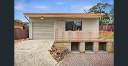 Spacious Family Home with Modern Updates & Self-Contained Retreat! - Photo 4