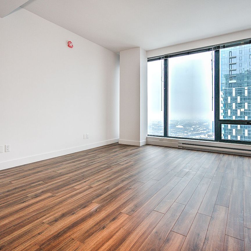 Located at the corner of Boulevard René-Lévesque Ouest and Rue Lucien L'Allier, the LIV is one of the most exciting to - Photo 1