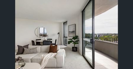 Sleek Top-Floor Sanctuary With City Skyline Vistas - Photo 3