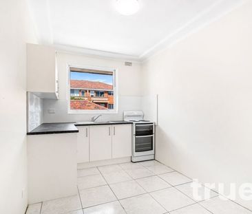 LIGHT FILLED APARTMENT IN IDEAL LOCATION - Photo 3