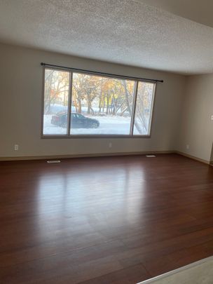 NEWLY RENOVATED 2 STORY 4 BEDROOM HOME WITH RENTED BASEMENT - Photo 1