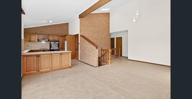 Spacious Family Living with Flexible Floor Plan in Prime Coniston Location - Photo 1