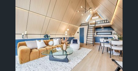 Stunning Loft-Style Unit with Large Playground and Sunroom - Photo 3