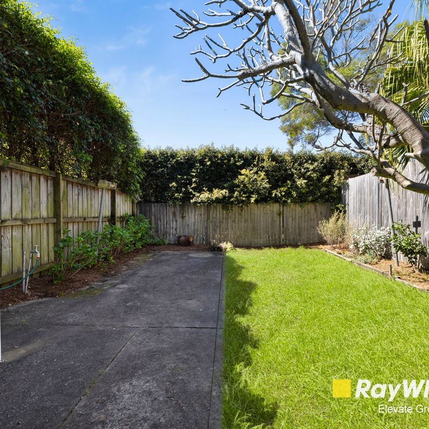 Spacious and Stylish Family Home with Sunroom and Large Backyard - Photo 1