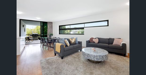 Modern Corner Apartment with Mountain Glimpses in Prime Location! - Photo 1