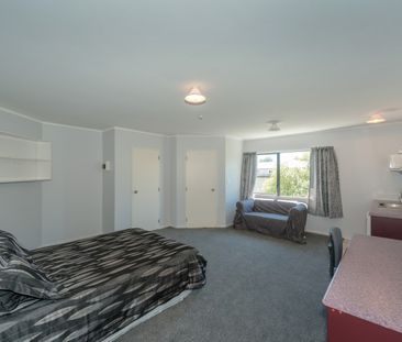 This furnished studio unit includes an ensuite bathroom and a small... - Photo 2