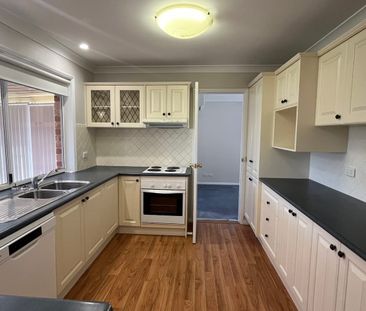 Bright Family Home with Sunroom and Outdoor Living Space - Photo 1