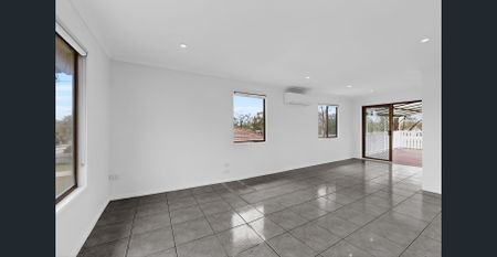 Beautiful High-Set Home with New Kitchen & Large Entertaining Deck - Photo 2